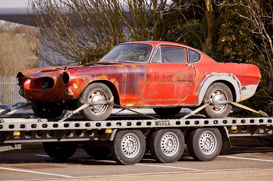 Broken Car on a Flatbed Truck About to be Sold